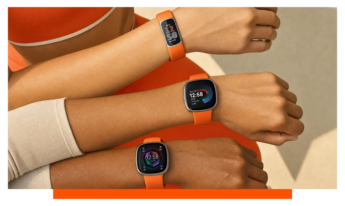 Three smartwatches worn on separate wrists, worn, mid-workout - Fitbit Charge 6 and Fitbit Versa 4 and Fitbit Sense 2