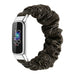 Fitbit Luxe Scrunchie Armband (Schwarzes Gold)