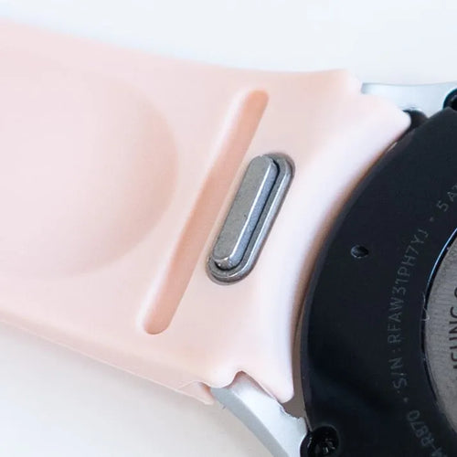 Silicone Strap 'One Push', pink, on a watch, 3/4 rear view